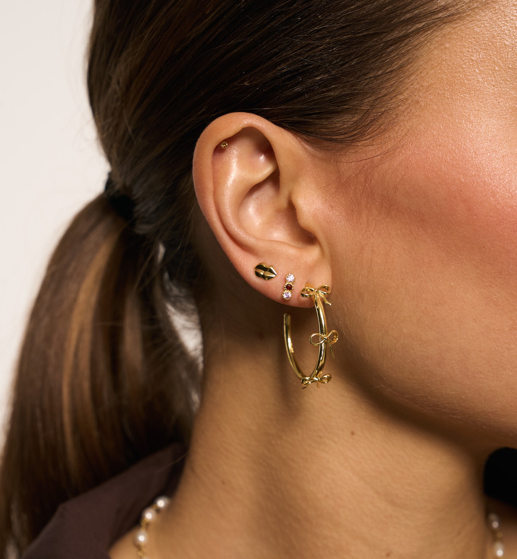 Grote strik oorringen - goud