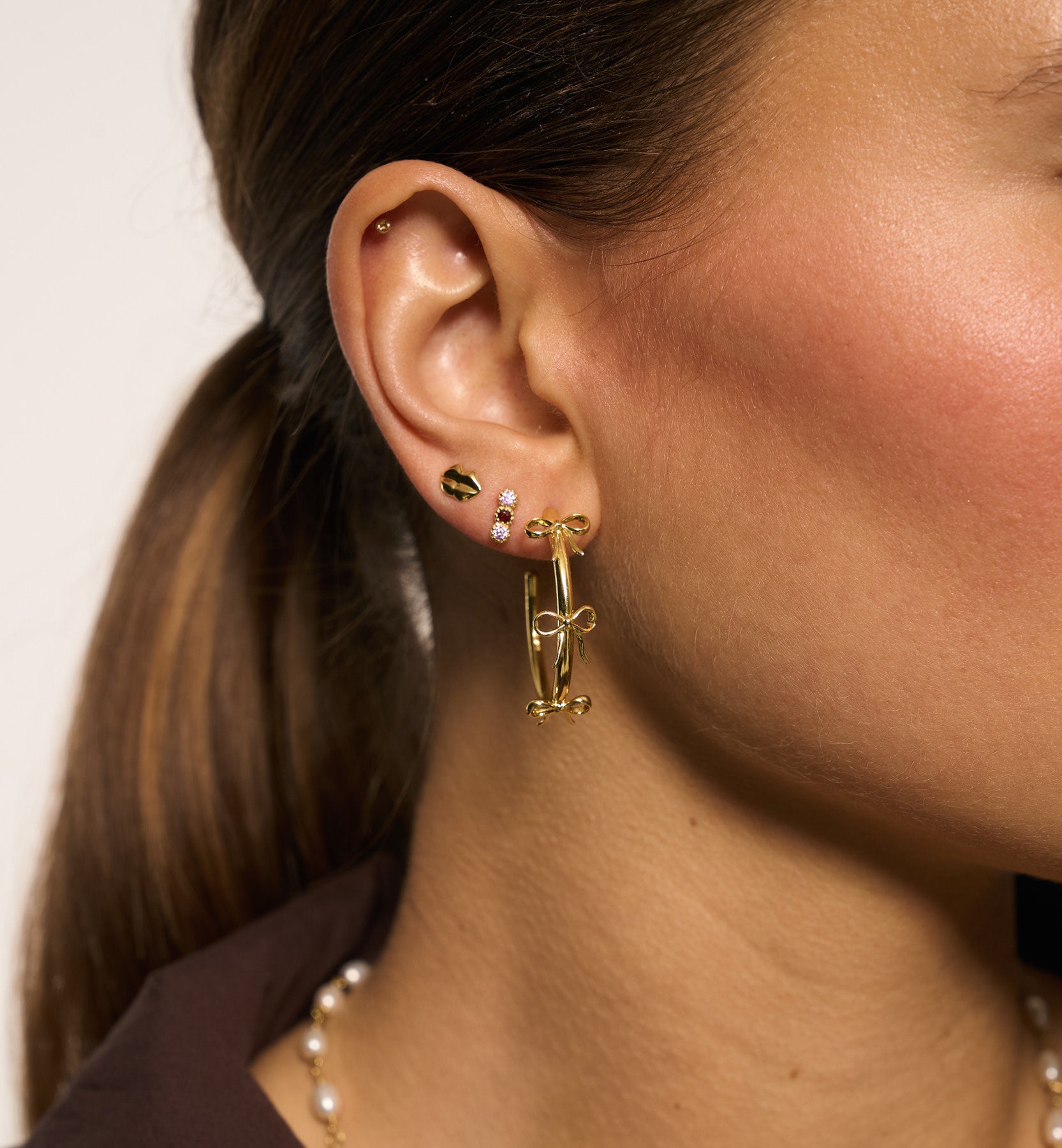 Grote strik oorringen - goud