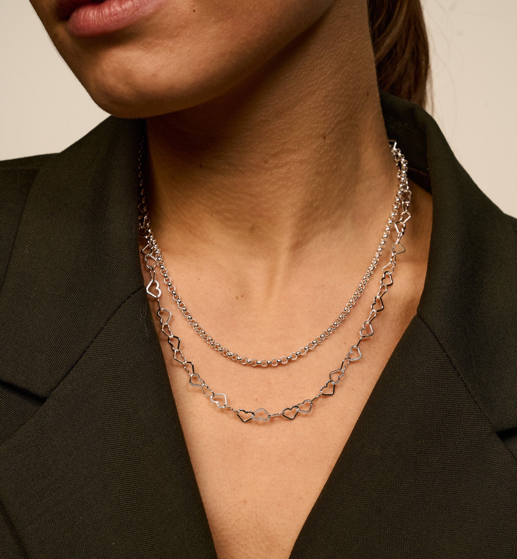 Halsketting met in elkaar verstrengelde hartjes - Zilver